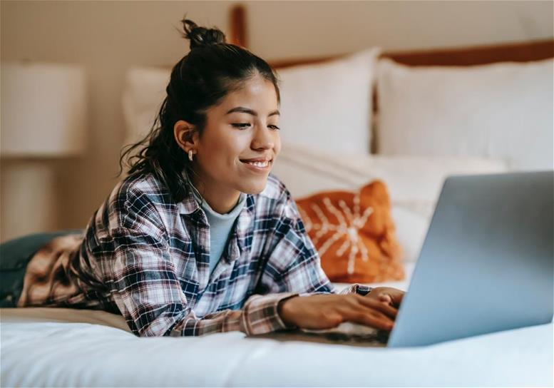 young adult woman with laptop computer