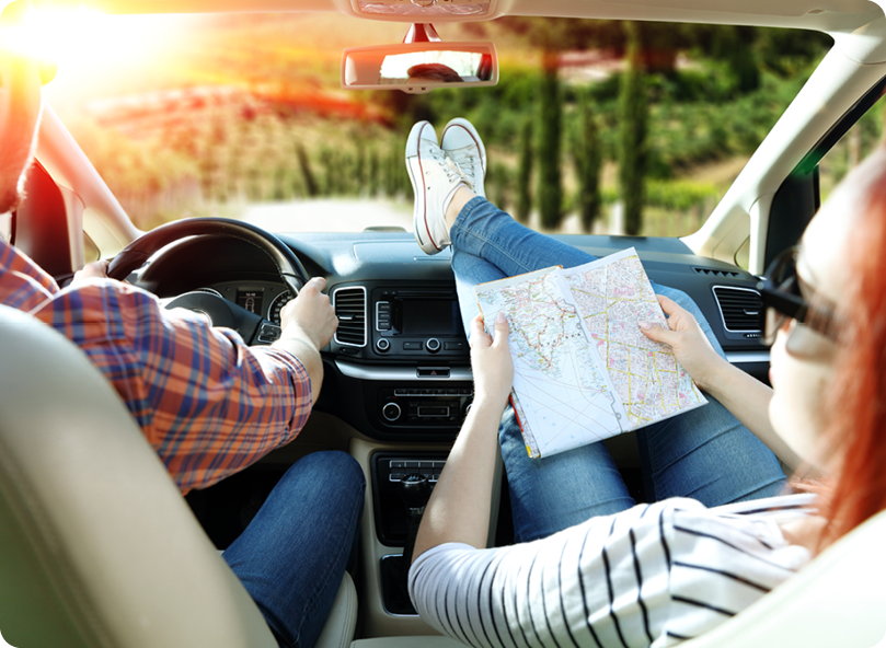 man and woman on road trip