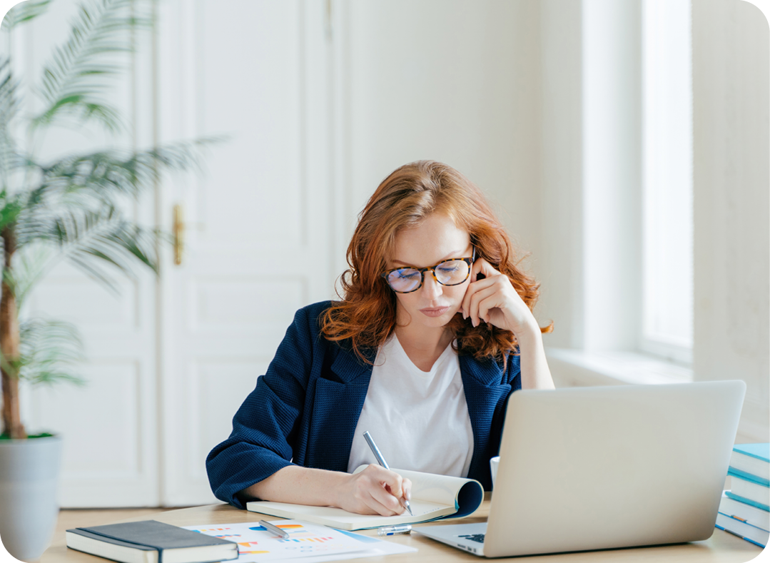 pensive woman doing paperwork