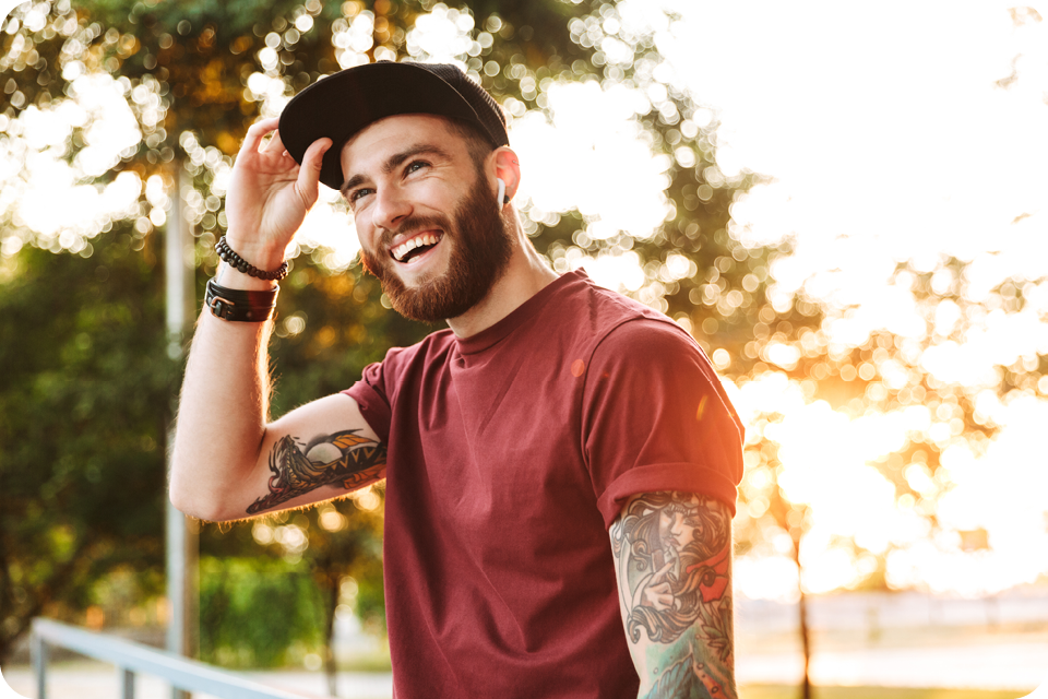 young tattooed man smiling
