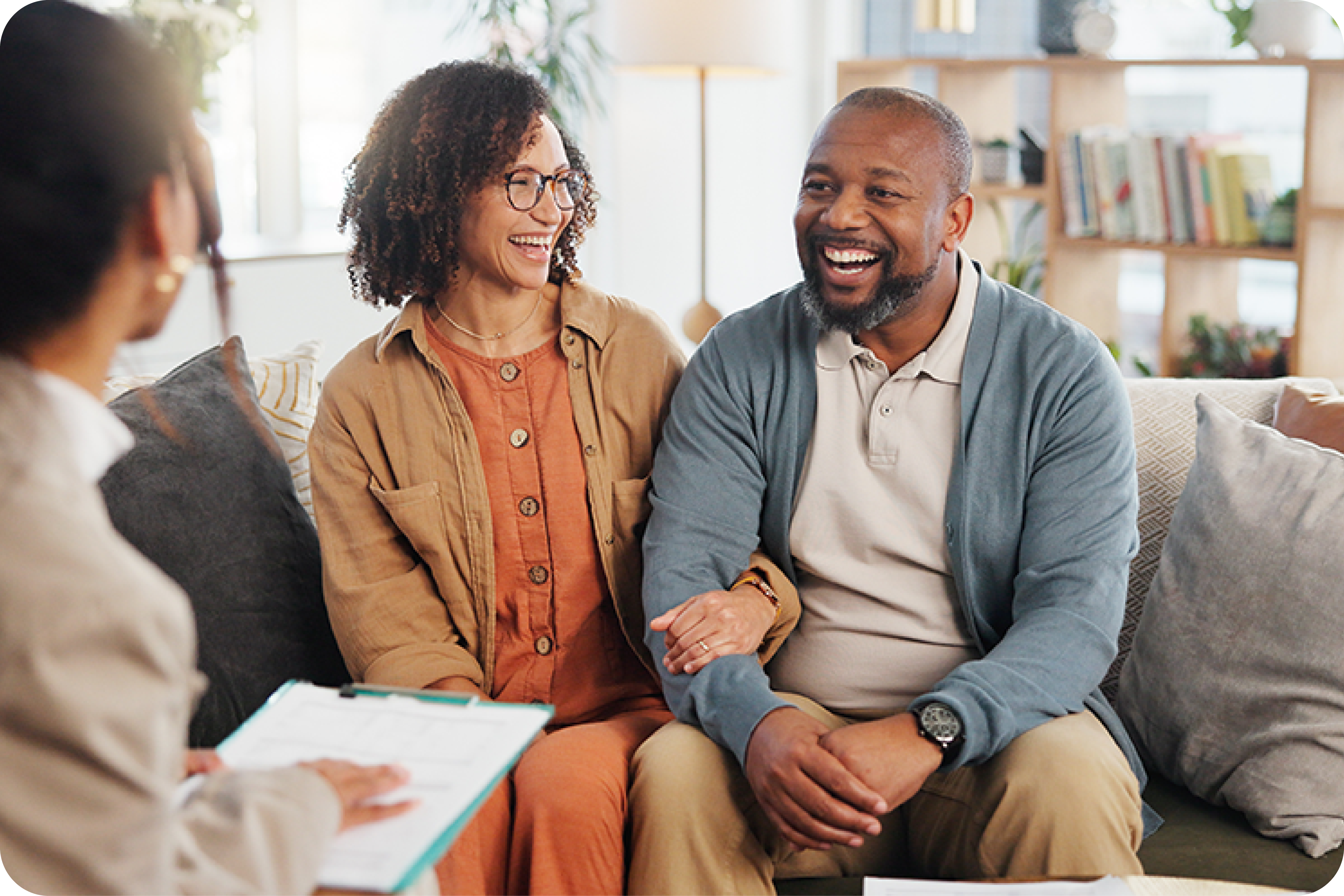 Happy couple having meeting with business woman