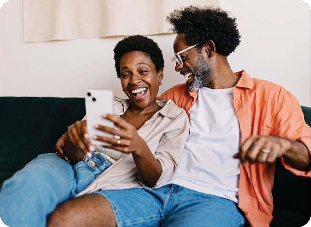 Happy couple relaxing together on couch