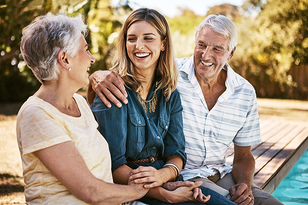 Elder parents chatting with daughter